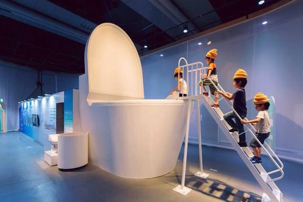 Children Dress As Poop & Jump In A Giant Toilet, Because Japan