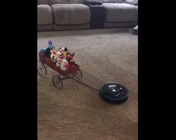 Watch A Roomba Take A Wagon Full Of Toys For A Ride