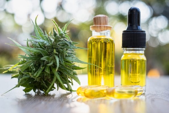 Vaping for Anxiety Glass bottles containing hemp oil, CBD and medicine extracted from hemp oil. Concept Medical options CBD hemp oil products Therapy with herbs that are extracted from cannabis.