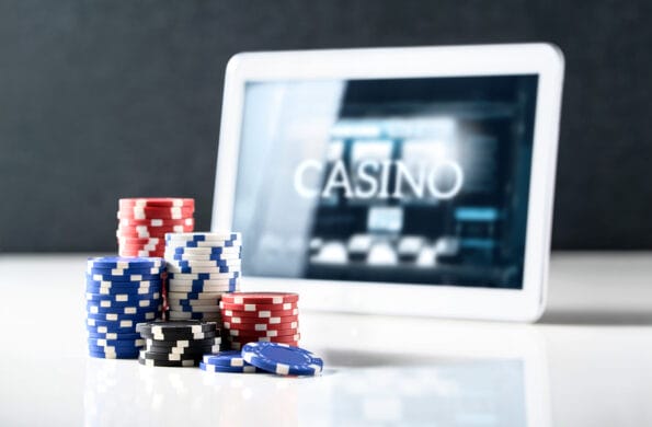Online Gambling On Mobile Casino Concept. Stack Of Poker Chips A