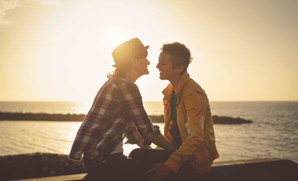 Happy gay couple dating day - Young lesbians women having tender romantic moments together outdoor - Lgbt lifestyle and homosexuality love relationship concept