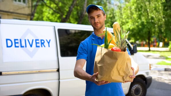 Delivery company worker holding grocery bag, food order, supermarket service