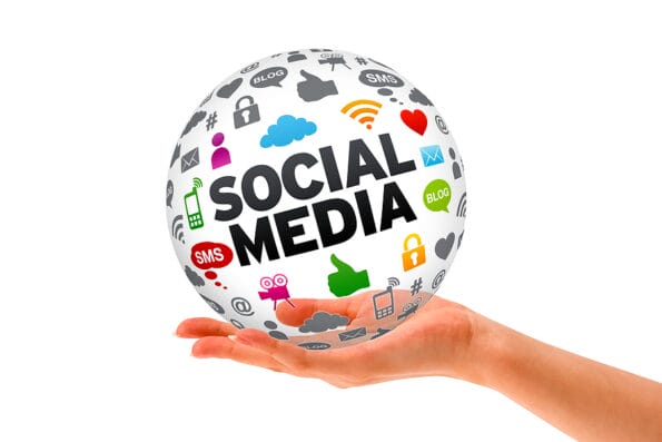 Hand holding a Social Media 3d Sphere sign on white background. Facebook advertising.