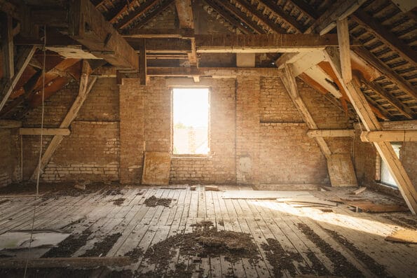 Old house attic home decor for renovation. Rustic attic for renovation. Attic in old house. Rustic attic for home decor. Sunset in old house attic. Old vintage house home decor. Old rustic house interior.