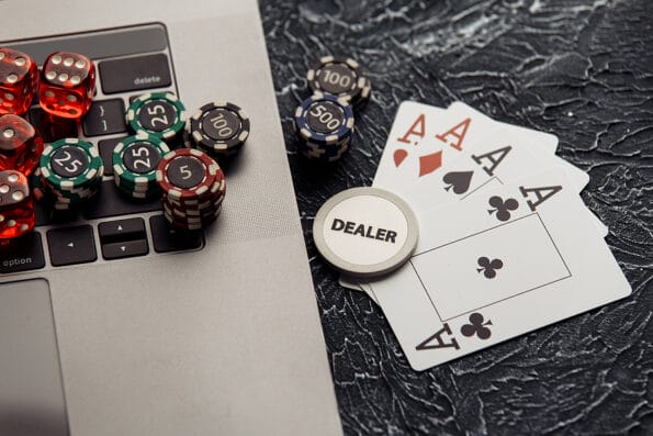 Chips, dices and playing cards for poker online or casino gambling. Online poker concept