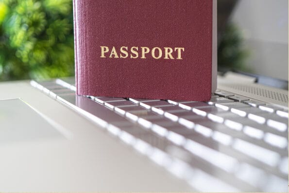 Passport on the keyboard. concept of online identification when registering on a website on the Internet. Internet by passport. Purchase of plane tickets. Hotel booking. online check-in for flight