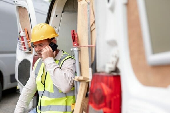 Contractor on the phone near a construction site