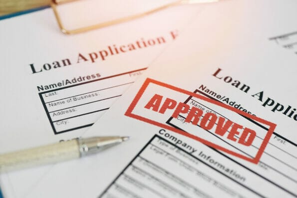 Loan approval, Loan application form with Rubber stamping that says Loan Approved, Financial loan money contract agreement company credit or person