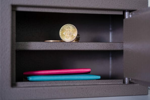Small residential vault with physical bitcoin. Bitcoin in a safe deposit box.