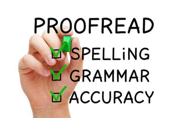 Hand filling Proofread checklist concept with checked boxes on spelling, grammar and accuracy.